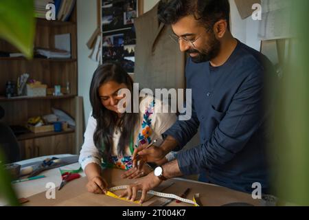 Fashion designers working on patterns in their studio Stock Photo