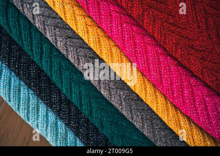 Multi colored Knitted woolen Â fabric texture background for winter. Stock Photo