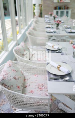 The wedding decor. Tables set for an event party or wedding reception. luxury elegant table setting dinner in a restaurant. glas Stock Photo