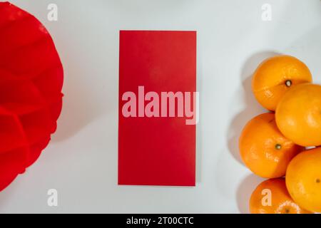 Decorated flat putting traditional pendant to the red Chinese New Year Celebrations for good luck. chinese word means blessing Stock Photo