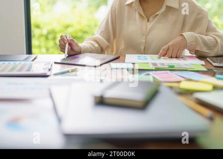 Creative idea Business female Artist Creative Designer sketch graphic drawing on graphic tablet and Color swatch samples Concept Stock Photo