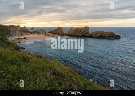 Playa de la Arnia in Santander, Cantabria, North Spain with cliffs and sandy beach. Popular travel destination  Stock Photo