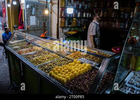 A market stall selling pickled olives preserved in olive oil, in Fes el Bali, in city of Fez, Morocco, North Africa Stock Photo