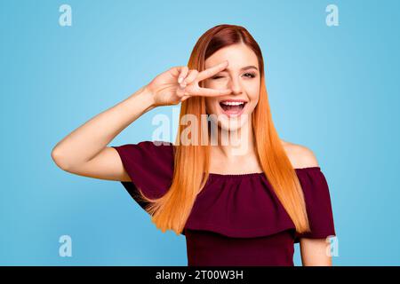 Closeup studio shooting photo portrait of chic attractive cute sweet lovely charming rejoicing delightful lady making v-sign near eyes laughing Stock Photo