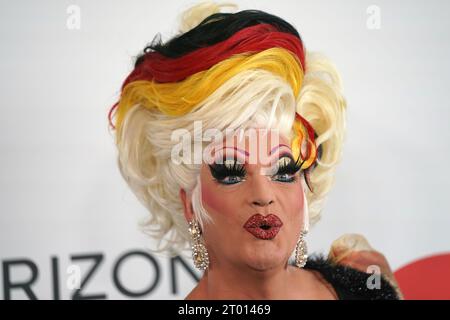 Hamburg, Germany. 03rd Oct, 2023. Drag queen Olivia Jones comes with a hairstyle in the colors black, red and gold on the plaza of the Elbphilharmonie for the ceremony. This year, the Hanseatic City of Hamburg is hosting the celebrations for the Day of German Unity. Credit: Marcus Brandt/dpa/Alamy Live News Stock Photo