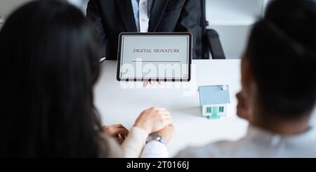 Close-up of female hand signing e-document with on tablet. Electronic signature and modern technologies concept Stock Photo