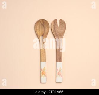 Empty wooden vintage fork and spoon with long handle, top view Stock Photo