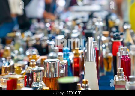 Many different perfume bottles in a flea market. Stock Photo