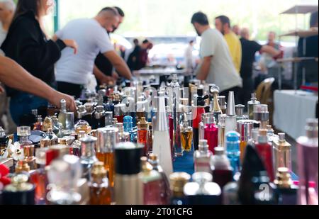 Many different perfume bottles in a flea market. Stock Photo
