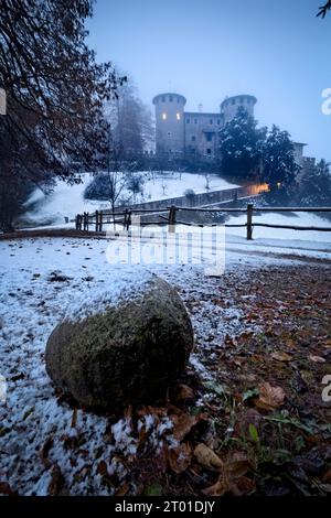 The medieval castle of Campo in snowy winter. Campo Lomaso, Giudicarie, Trentino, Italy. Stock Photo