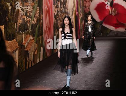 Paris, France. 3rd Oct, 2023. Models present creations by French fashion house Chanel as part of its Spring/Summer 2024 ready-to-wear collections during the Paris Fashion Week in Paris, France, on Oct. 3, 2023. Credit: Gao Jing/Xinhua/Alamy Live News Stock Photo