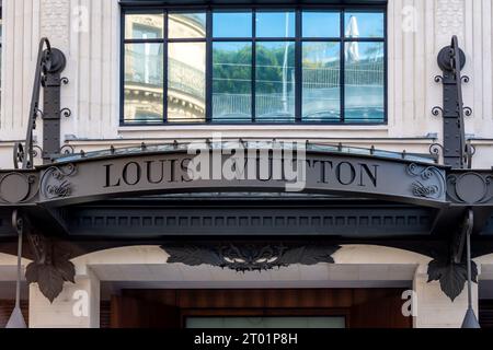 Sign at the entrance to the Louis Vuitton headquarters. Louis Vuitton is a French luxury fashion house Stock Photo
