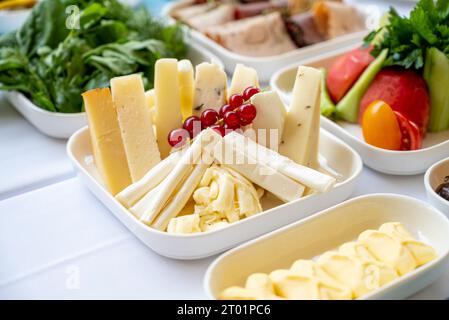 Traditional Turkish Breakfast served with traditional turkish tea on wooden table Stock Photo