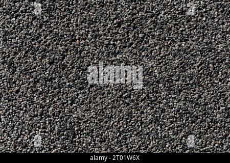 Crushed granite stones wall - close up background Stock Photo