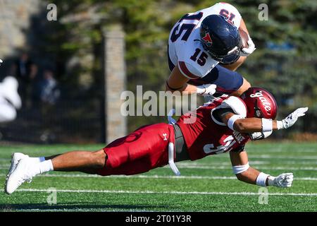 September 16, 2023: Pennsylvania Quakers tight end Bryce Myers (15) goes airborne while being tackled by Colgate Raiders defensive back Arthur Hamlin (34) during the second half on Saturday Sept. 16, 2023 at Andy Kerr Stadium in Hamilton, New York. Pennsylvania won 20-6. Rich Barnes/CSM Stock Photo