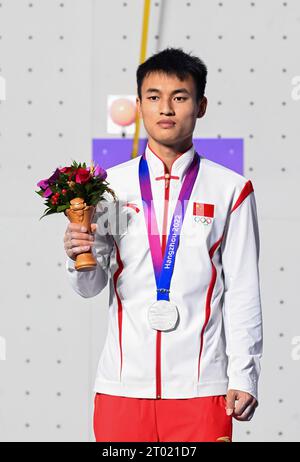 Shaoxing, China's Zhejiang Province. 3rd Oct, 2023. Long Jinbao of China attends the victory ceremony for the Men's Speed Match of Sports climbing at the 19th Asian Games in Shaoxing, east China's Zhejiang Province, Oct. 3, 2023. Credit: Yang Guanyu/Xinhua/Alamy Live News Stock Photo