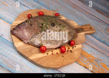 Saint-Pierre Seafish, Zeus Faber, John Dory, Pez de San Pedro, fish, isolated on cutting board background Stock Photo