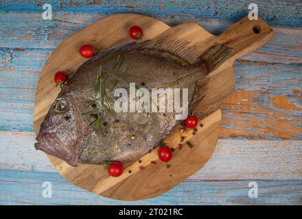 Saint-Pierre Seafish, Zeus Faber, John Dory, Pez de San Pedro, fish, isolated on cutting board background Stock Photo