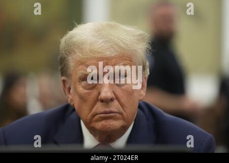 New York, United States. 03rd Oct, 2023. Former United States President Donald Trump sits in the courtroom for day two of his civil fraud trial at State Supreme Court on Tuesday, October 3, 2023 in New York City. This case, brought last September by New York Attorney General Letitia James who accused Trump, his eldest sons and his family business of inflating Trump's net worth by more than $2 billion by overvaluing his real estate portfolio. Pool Photo by Seth Wenig/UPI Credit: UPI/Alamy Live News Stock Photo