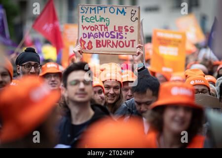 Manchester, UK. 03rd Oct, 2023. Consultants and junior doctors hold placards expressing their opinions during the Conservative Party Conference. Hundreds of Junior Doctors and Consultants staged a rally during the Conservative Party Conference. Represented by the British Medical Association (BMA), which is staging the latest in a series of three-day strikes. The union wants to negotiate and see its members receive a pay rise. Credit: SOPA Images Limited/Alamy Live News Stock Photo