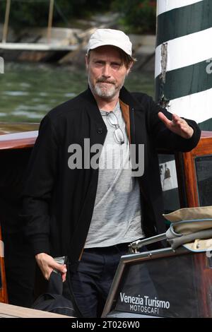 VENICE, ITALY -AUGUST 31: Mads Mikkelsen, arrives at the Hotel Excelsior pier for the 80th Venice International Film Festival 2023 on AUGUST 31, 2023 Stock Photo