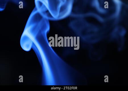 Blue and purple steam on a black background stock image in 2023