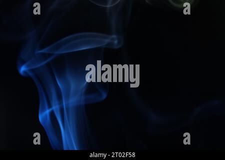 Blue smoke on a dark background, abstract photography Stock Photo