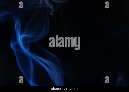Blue smoke on a dark background, abstract photography Stock Photo