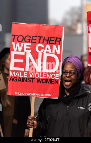 Protester at a Million Women Rise protest against male violence towards women in all its forms. London, UK. Stock Photo