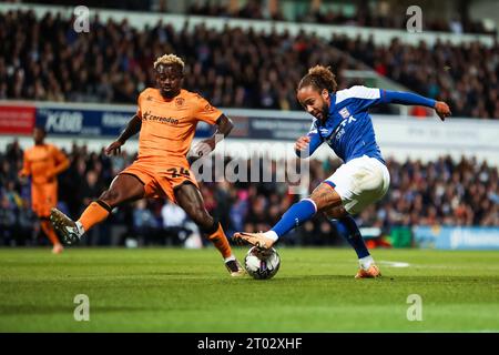 Ipswich, UK. 03rd Oct, 2023. Hull City's Jean Michael Seri applies pressure to Ipswich Town's Marcus Harness during the Ipswich Town FC v Hull City FC sky bet EFL Championship match at Portman Road, Ipswich, United Kingdom on 3 October 2023 Credit: Every Second Media/Alamy Live News Stock Photo