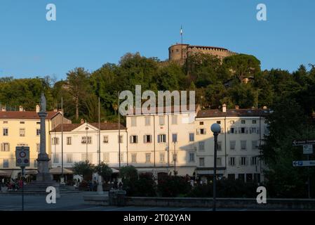 Gorizia, Italy (30th September 2023) - Piazza della Vittoria square in the historical center with the medieval castle above the hill Stock Photo