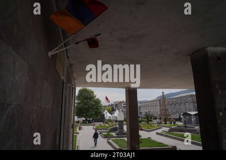 The flag of Armenia is seen hanging in a building while flag of Republic of Nagorno-Karabakh is hoisted in the main square of Goris. Armenia reported on the 3rd October that around 100,625 refugees have arrived from Nagorno-Karabakh while 91,924 of them have been already registered by Armenian officials after Azerbaijan took control of the southern mountainous region. Stock Photo