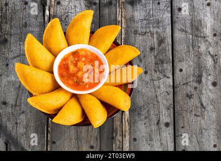 Colombian empanada with spicy sauce - Traditional food from Colombia