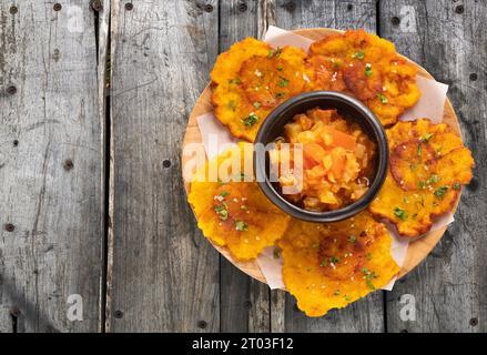 Patacon or toston, fried and flattened pieces of green plantain Stock Photo