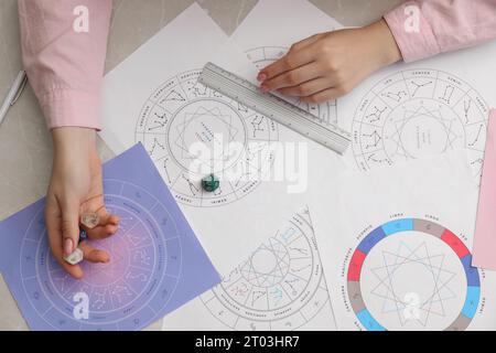 Astrologer using dices for fate forecast at table, top view. Fortune telling Stock Photo