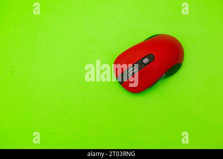 wireless computer mouse isolated on green background Stock Photo