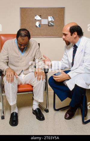 Kenneth Davis (born 1947), American doctor speaking to a patient. Davis is best known for his research led to the FDA-approval of five Alzheimer's drugs and developing the Alzheimer's Disease Assessment Scale. Davis serves as the CEO of the Mount Sinai Health System in New York, USA. Stock Photo