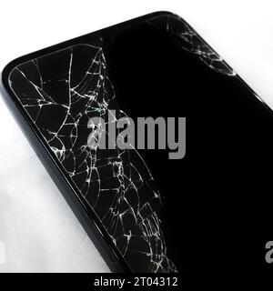 The phone screen cracked from falling on the floor Stock Photo