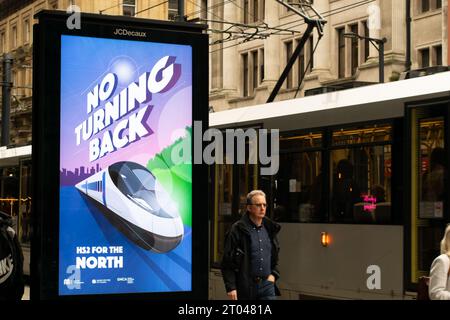 Display advert for HS2 with text No Turning Back, Manchester City centre. Metrolink tram. Conservative party Conference week. Stock Photo