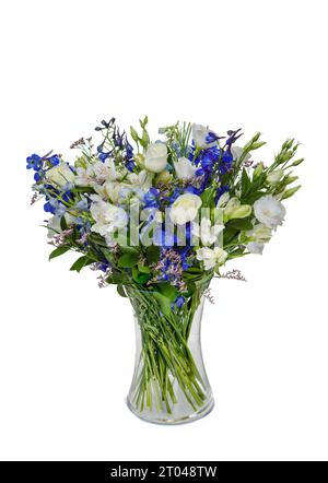 Beautiful huge bouquet of white roses with lilies and blue flowers in vase isolated on white background. Stock Photo