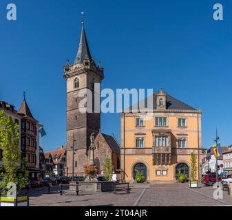 Obernai, France - 09 07 2023: The wine route. View of the Belfry of Obernaiand, the city Hall and the Sainte-Odile fountain from the Christmas market Stock Photo