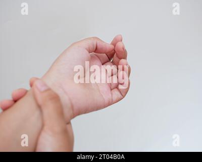 close up woman holding her wrist symptomatic Office Syndrome. health care concept Stock Photo