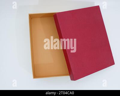 red and brown open gift box isolated on white Stock Photo