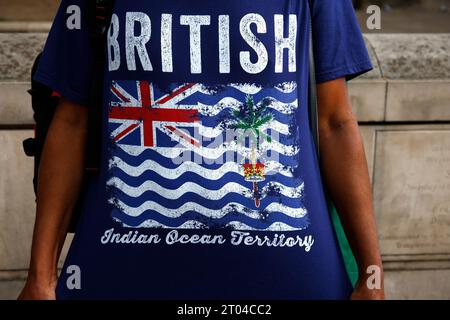 London, UK. October 3, 2023. British Indian Ocean Territory flag seen on a T-shirt at protest in London in support of the British Sovereignty of the BIOT. Credit: Joe Kuis / Alamy Reportage Stock Photo