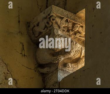Detail of a finely sculpted capital on the facade of the church of the abbey of Santa Maria di Pulsano. Monte Sant'Angelo, province of Foggia, Puglia, Stock Photo