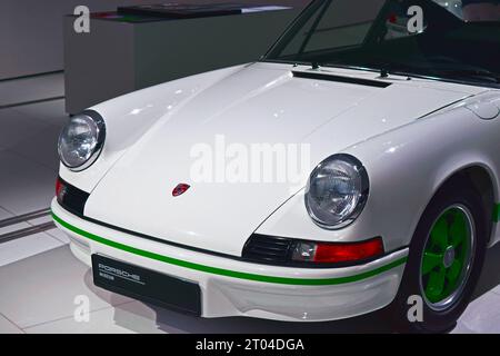 Amazing White Porsche Carrera with a Green Stripe and Green Wheels Stock Photo