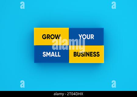 Business growth concept. The message grow your small business on colorful blocks. Stock Photo