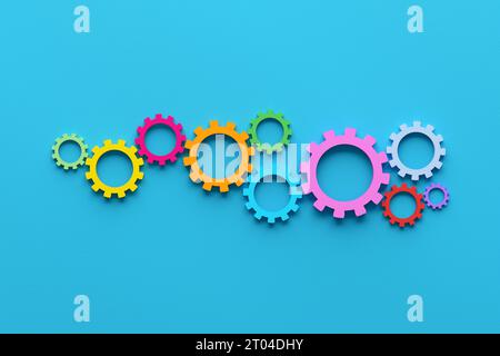 Business processes, teamwork and workflow automation concept. Cogwheels or gears on blue background. Stock Photo