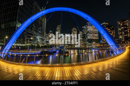 Perth, WA, Australia - City skyline illuminated at night as seen from Elizabeth Quay Bridge Stock Photo