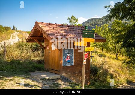 A wooden waterless and eco-friendly composting toilet provided for cyclists, walkers and hikers in countryside near Lake Montynard-Avignonet in Mayres Stock Photo